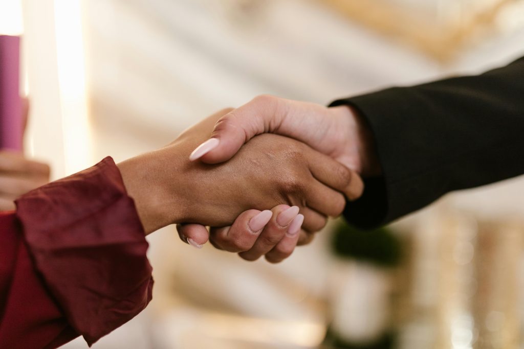 pexels-photo-8069744-8069744 Close-up of two professionals shaking hands, symbolizing agreement and partnership.